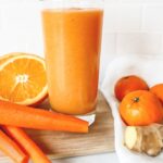 Orange carrot ginger smoothie with fresh carrots, oranges and ginger
