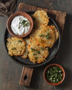 Carrot parsnip latkes with sour cream and herbs
