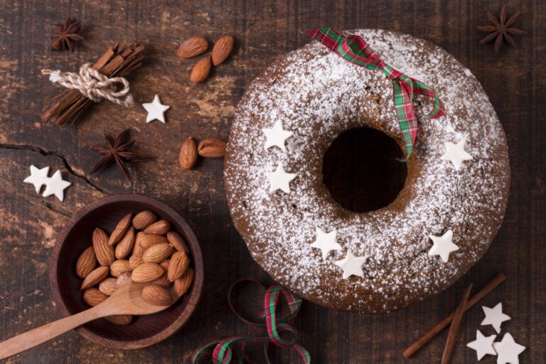 Gingerbread bundt cake dusted with powdered sugar and decorated with stars