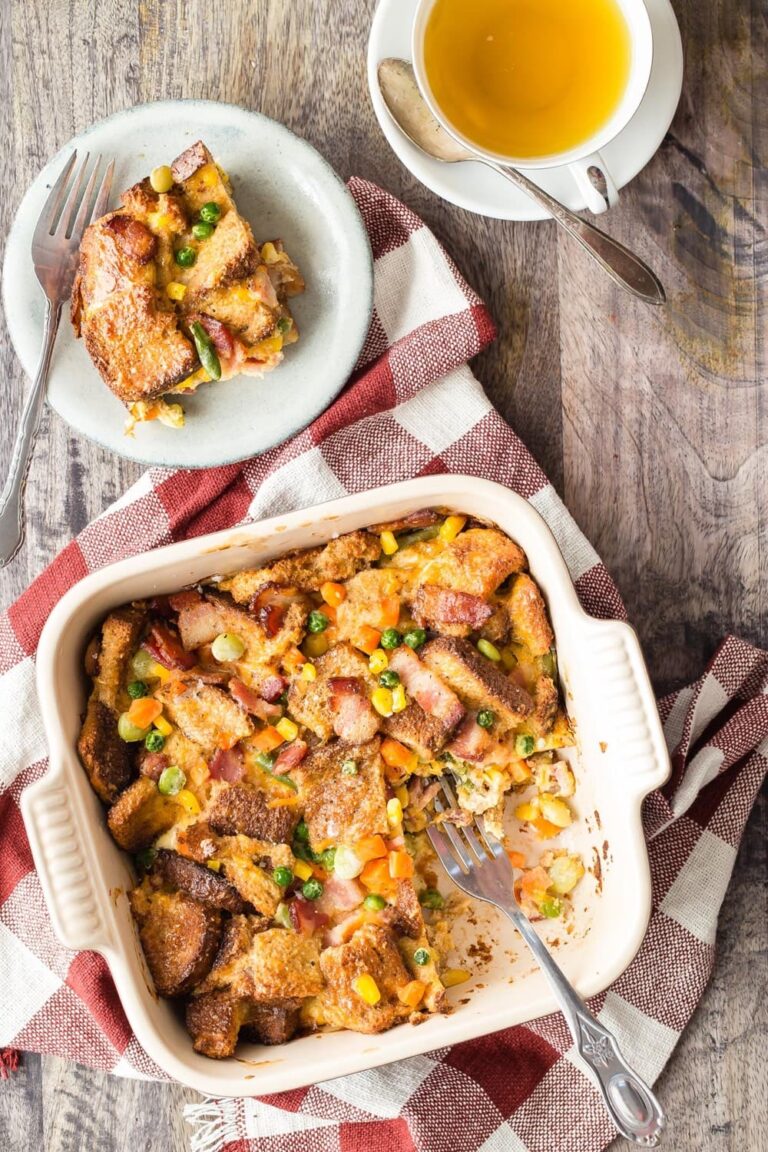 Breakfast casserole in a baking dish with a serving on a plate