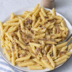 Penne with caramelized shallots and Gruyère on a plate