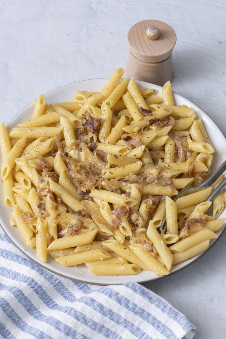 Penne with caramelized shallots and Gruyère on a plate