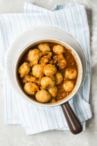 Chicken teriyaki meatballs in a small saucepan