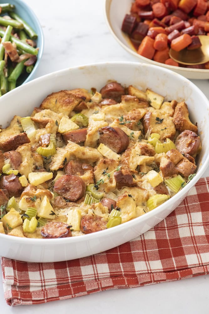 Apple and sausage stuffing in an oval baking dish