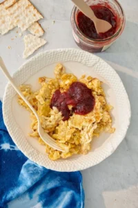 Matzah brei scrambled with eggs and topped with jam
