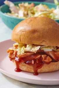 Pulled barbecue chicken sandwich with coleslaw on a bun