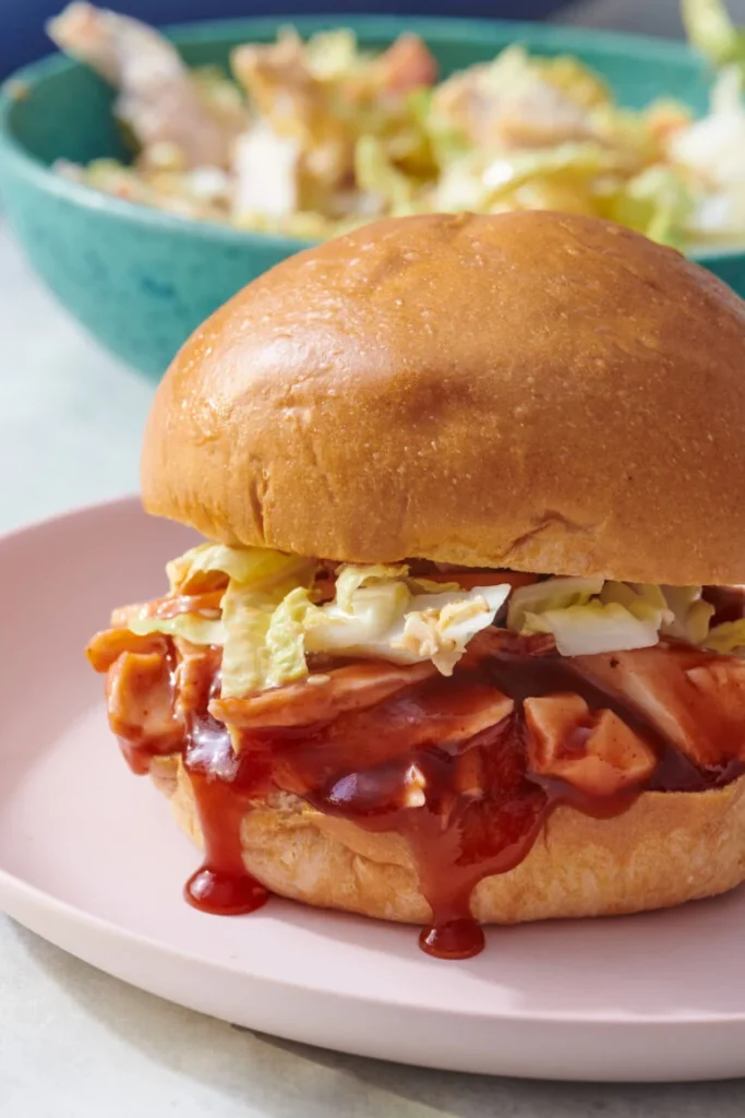 Pulled barbecue chicken sandwich with coleslaw on a bun