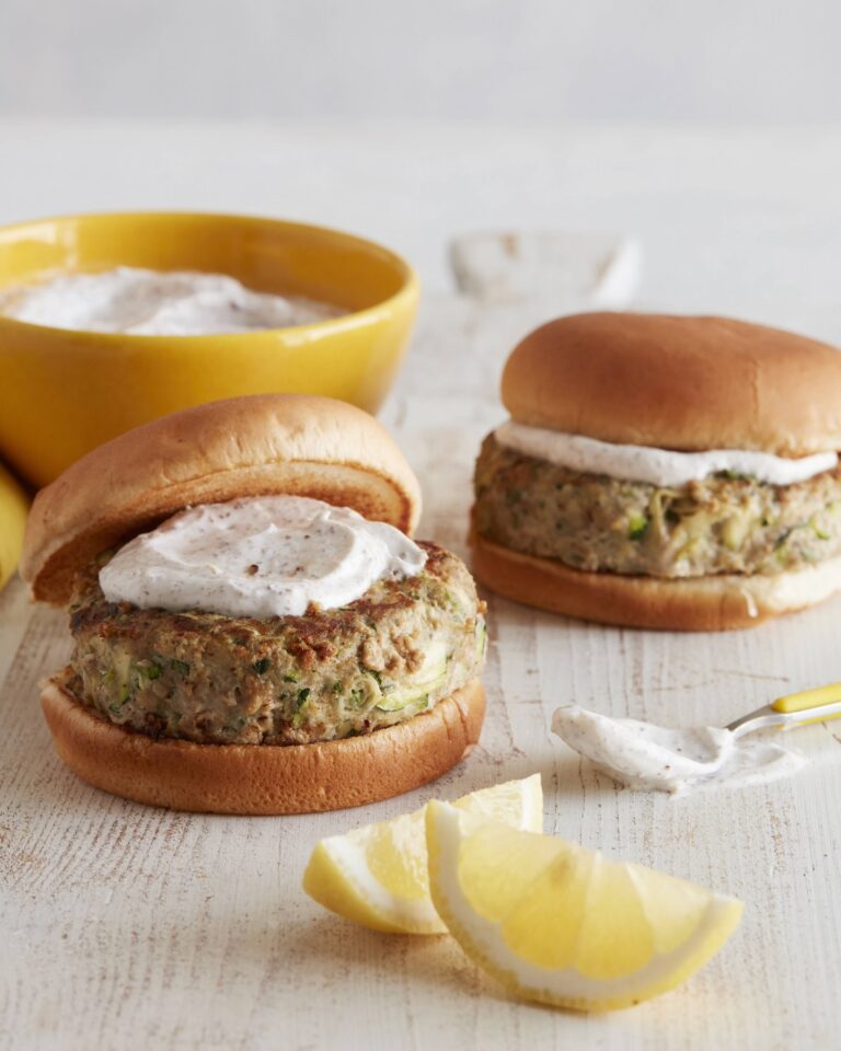 Turkey zucchini burgers on buns with a yogurt sauce