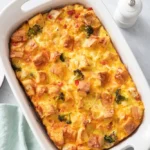 Baked vegetable strata in a white baking dish