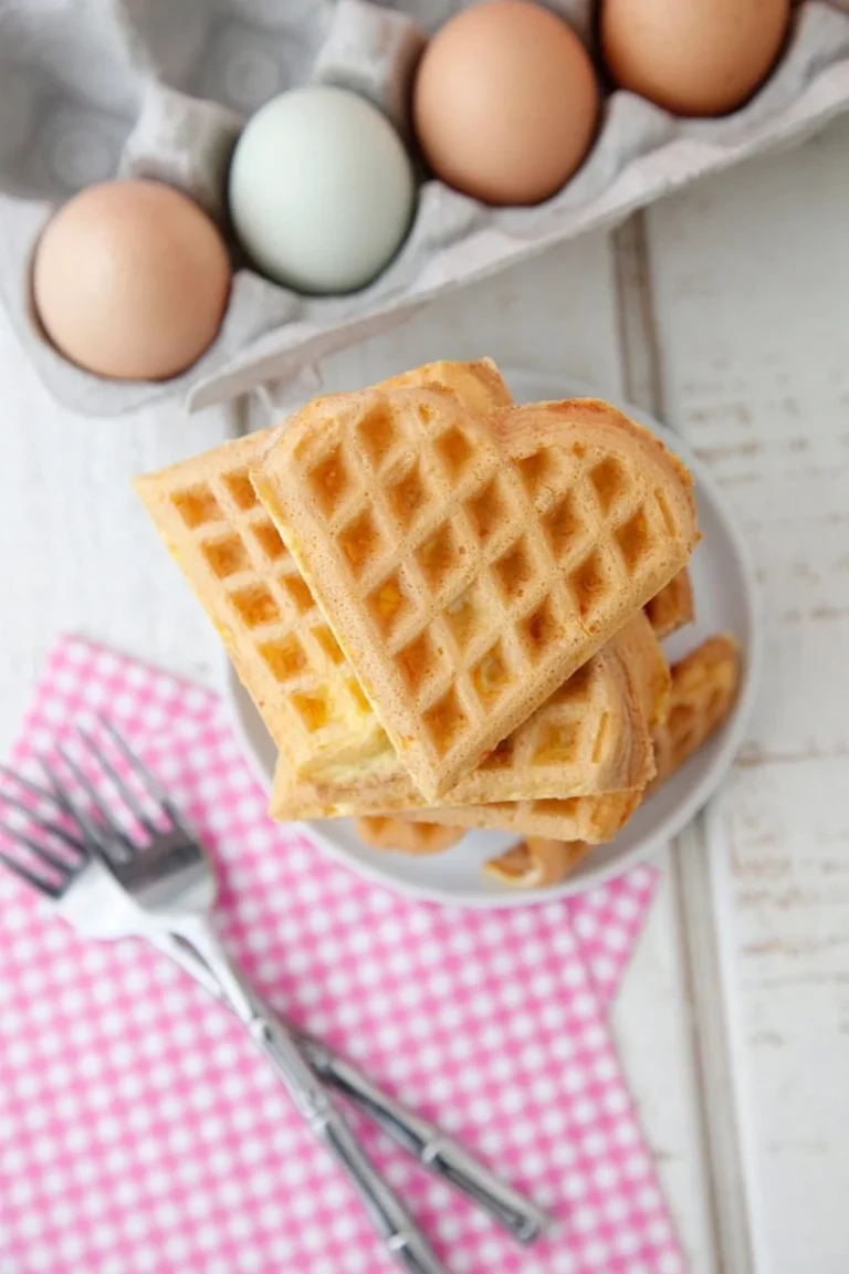 Waffle iron eggs cut into wedges on a plate