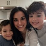 Alina Mauritz & her sons 6 and 9, smiling for a picture