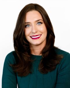 Portrait of Amanda Ashcraft in a green sweater
