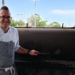 Chef Bob Bennett beside the smoker at Zingerman's Roadhouse