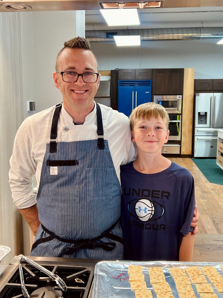 Chef Bob Bennett and his son Lucas in a kitchen