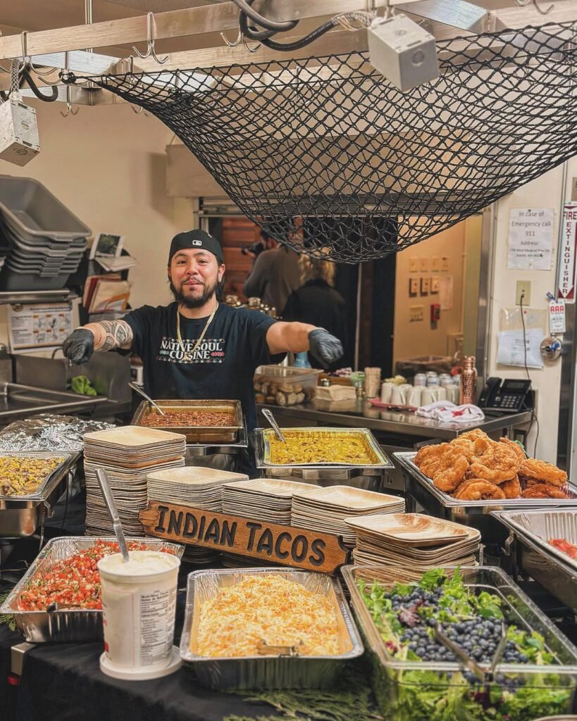 Chef Jeremy in the kitchen serving up Indian Tacos