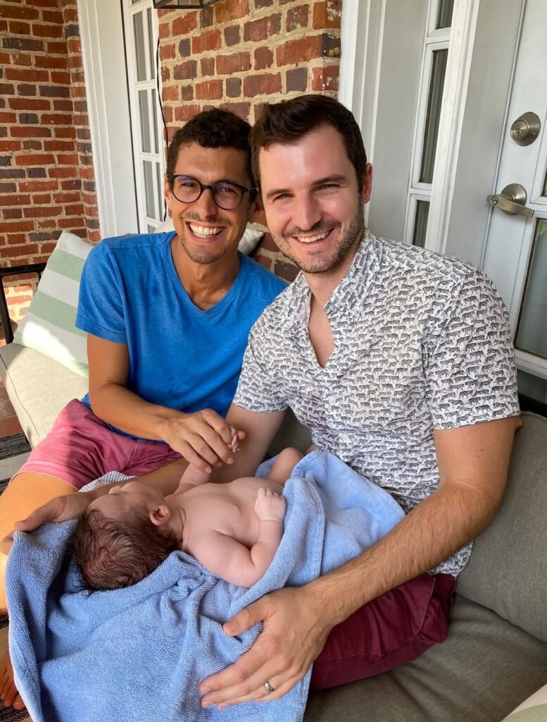 Danny, his husband Steve, and one of their daughter’s as a baby
