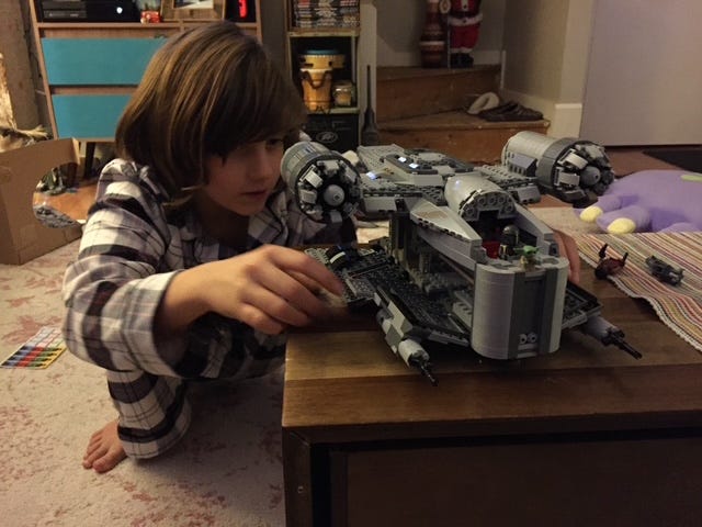 Emily’s son building a Lego set at the table