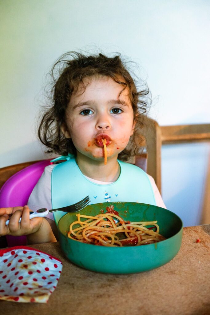 Guilia's daughter Livia eating a bowl of spaghetti