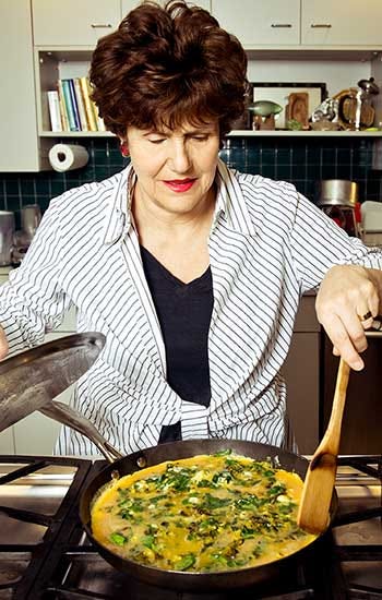 Joan Nathan cooking a frittata in her kitchen