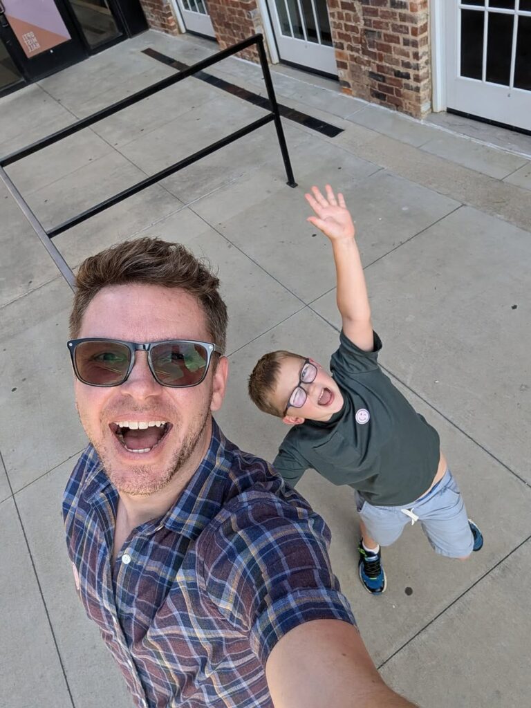 Justin and his son Jasper smiling for a selfie