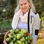 Lauren Driscoll, Founder and CEO of NourishedRX hold a bowl of green tomatoes