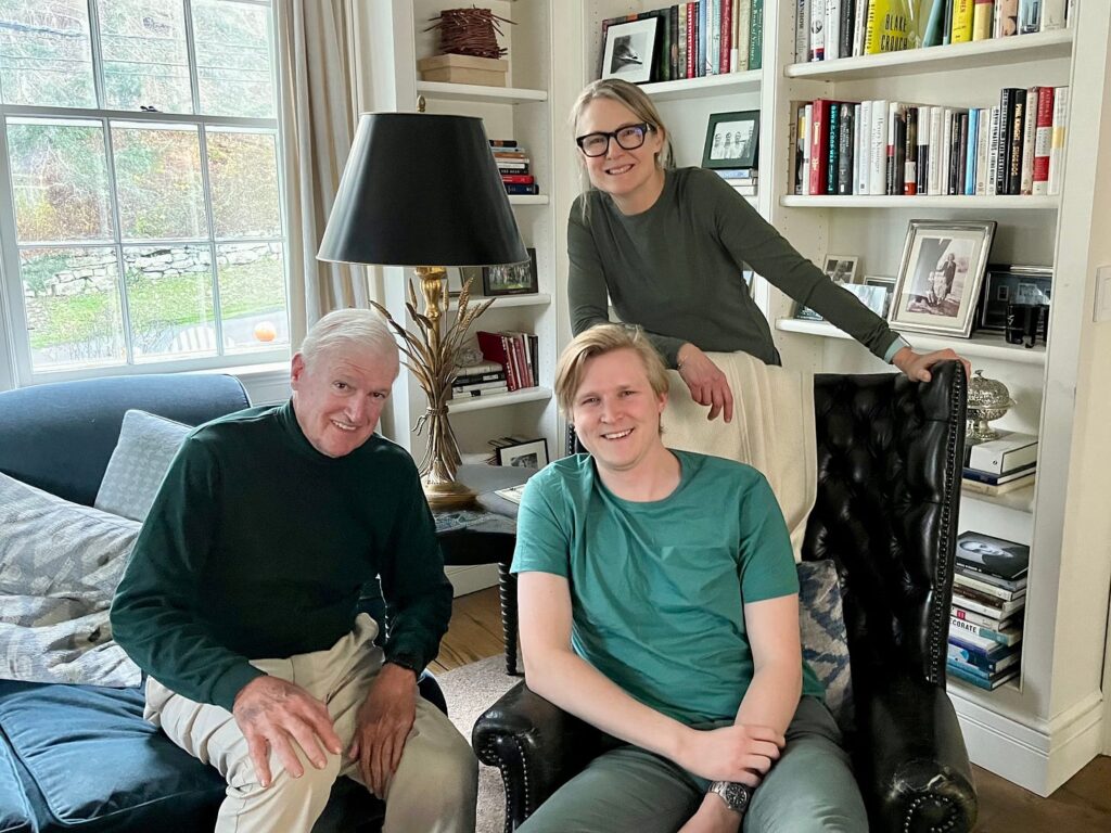 Lauren, her father, and her son sitting in the living room