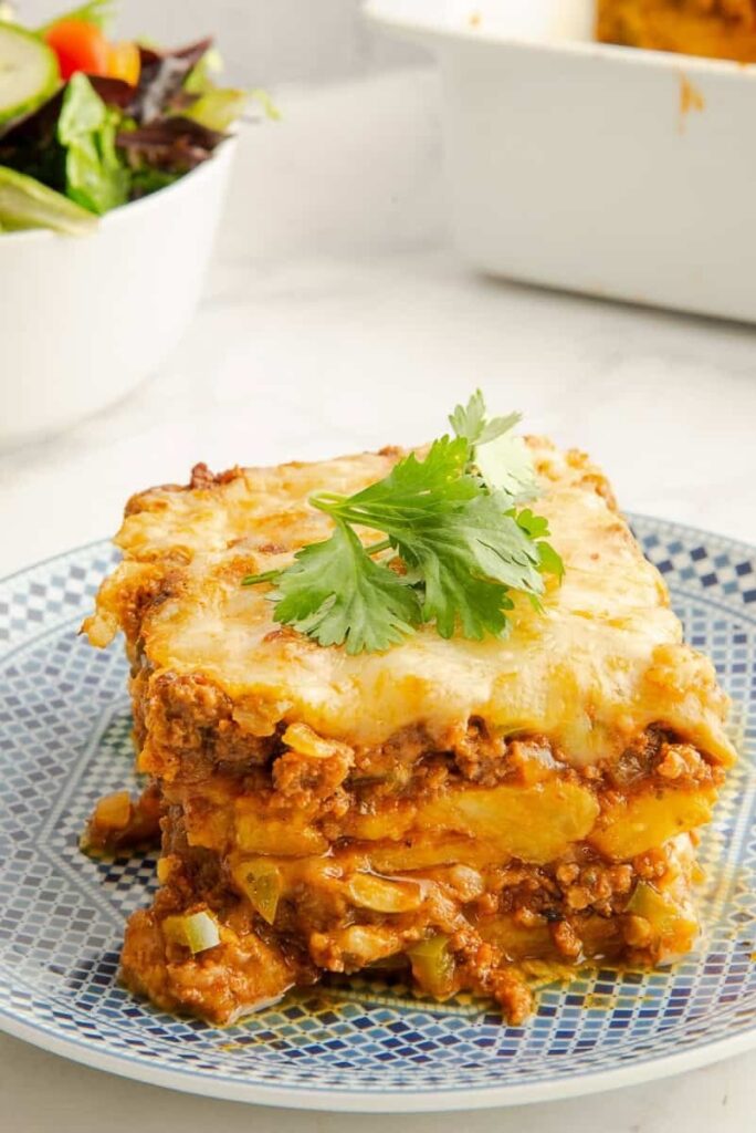 A serving pastelón cut to show the layers.