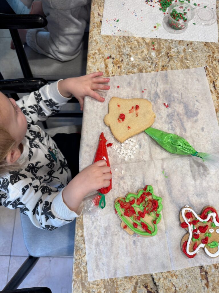 Micah's son frosting Christmas cookies