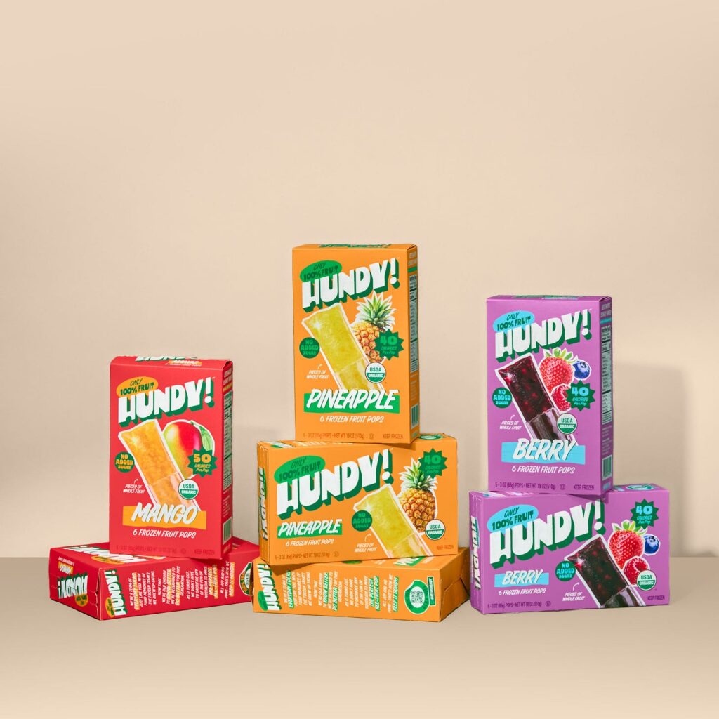 red, orange and purple Hundy boxes piled in front of a tan background