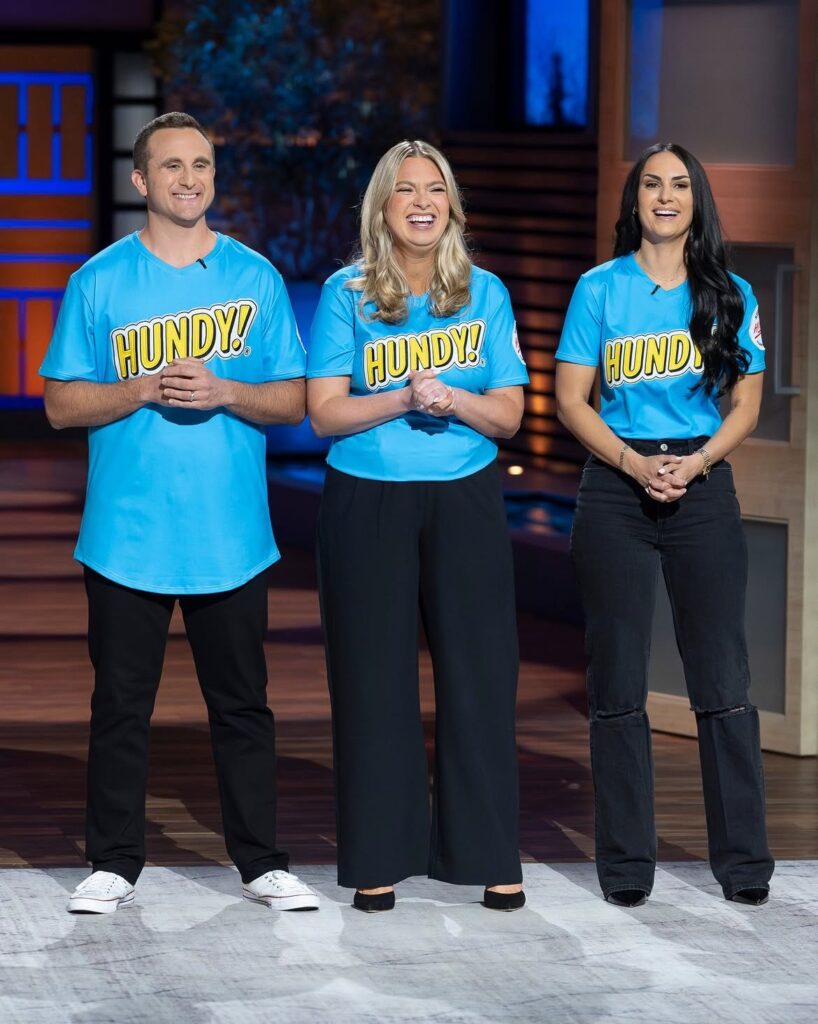 The Hundy team wearing blue and yellow Hundy t shirts on Shark Tank (ABC)