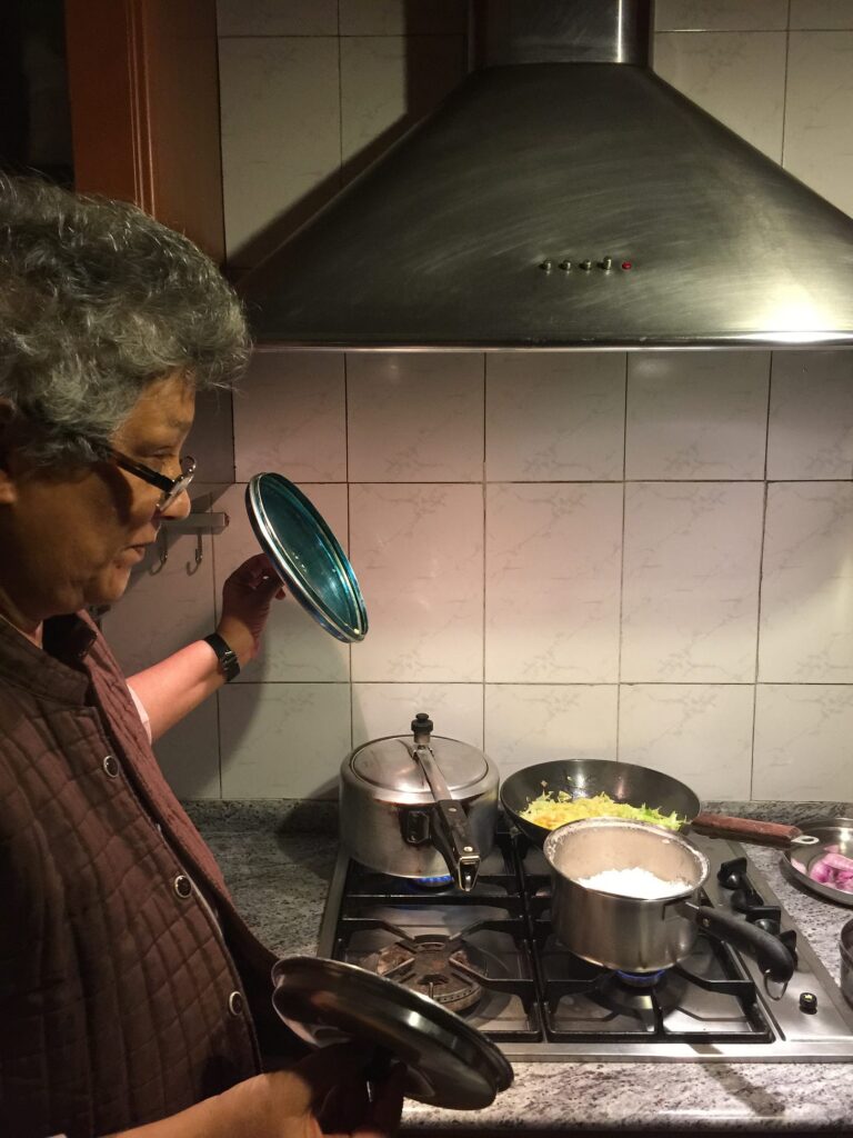 A woman cooking at the stove