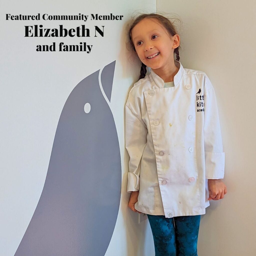 Elizabeth N, a One Potato featured community member, in a chef's coat