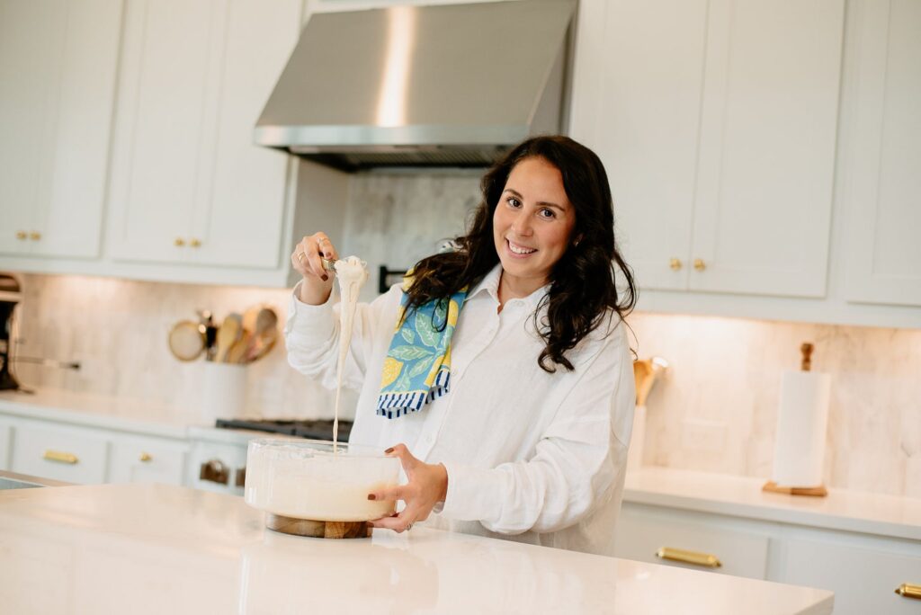 Rebecca Smith prepping tortilla de verde in her all white kitchen