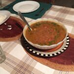 Bowl of rajma dal on a set table with rice