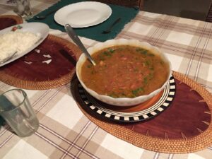 Bowl of rajma dal on a set table with rice