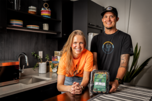 Rebecca Wickre and Ben Jacobs of Tocabe in a kitchen with a package of Tocabe food