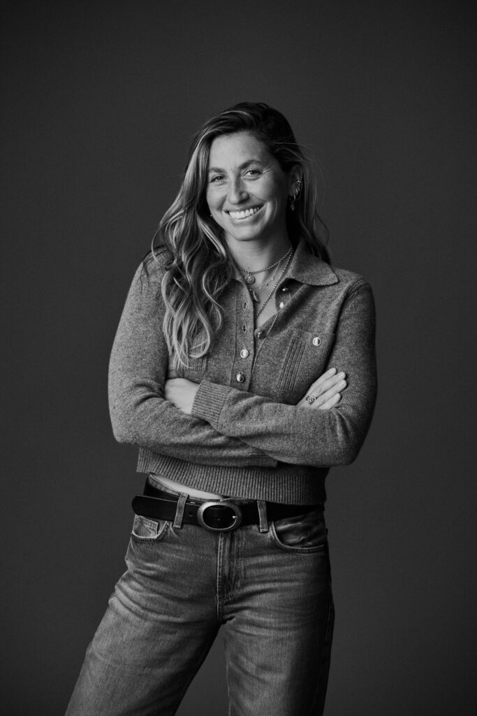 Black-and-white portrait of Sabrina Rudin with her arms crossed