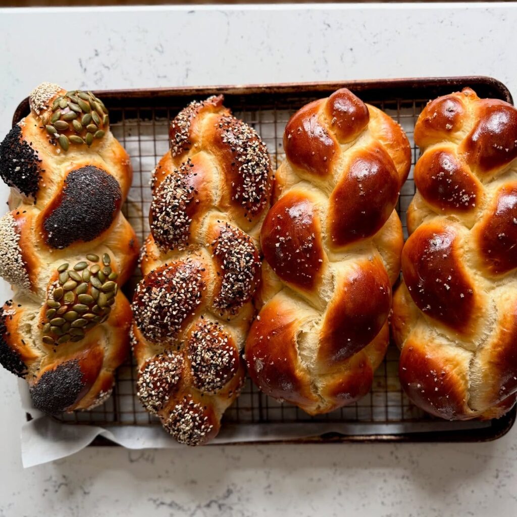 Challah on a cooling rack and tray