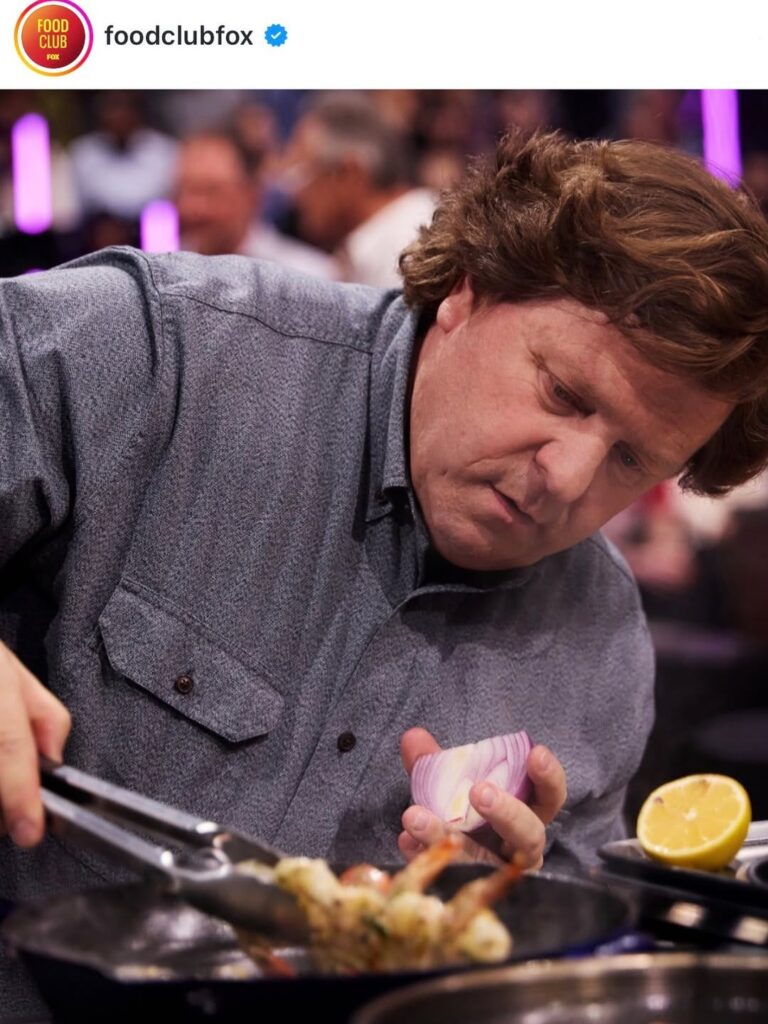 Ted Pappas in a grey shirt cooking with an iron skillet on MasterChef 16