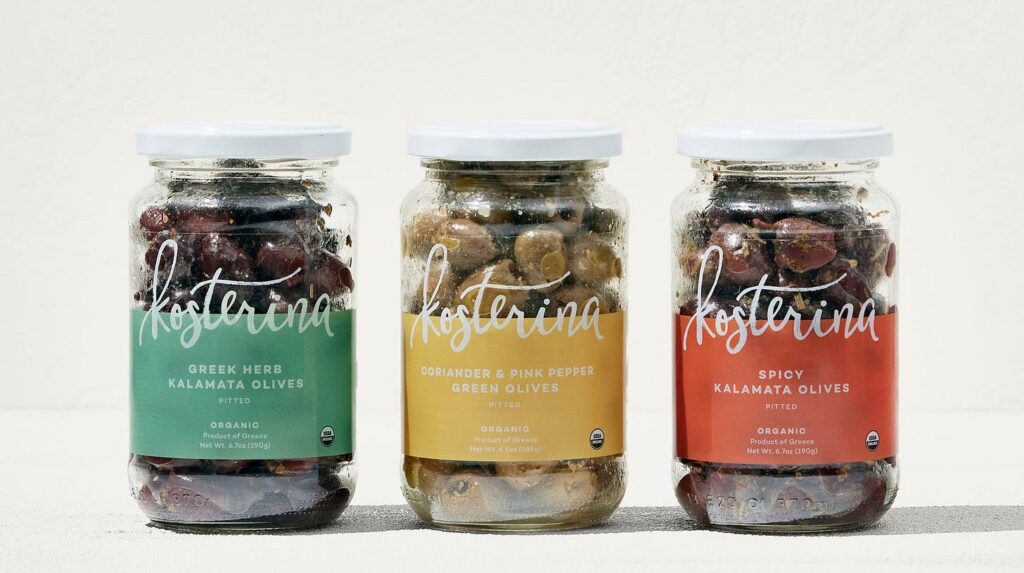3 glass jars of Kosterina Kalamata Olives on a white background