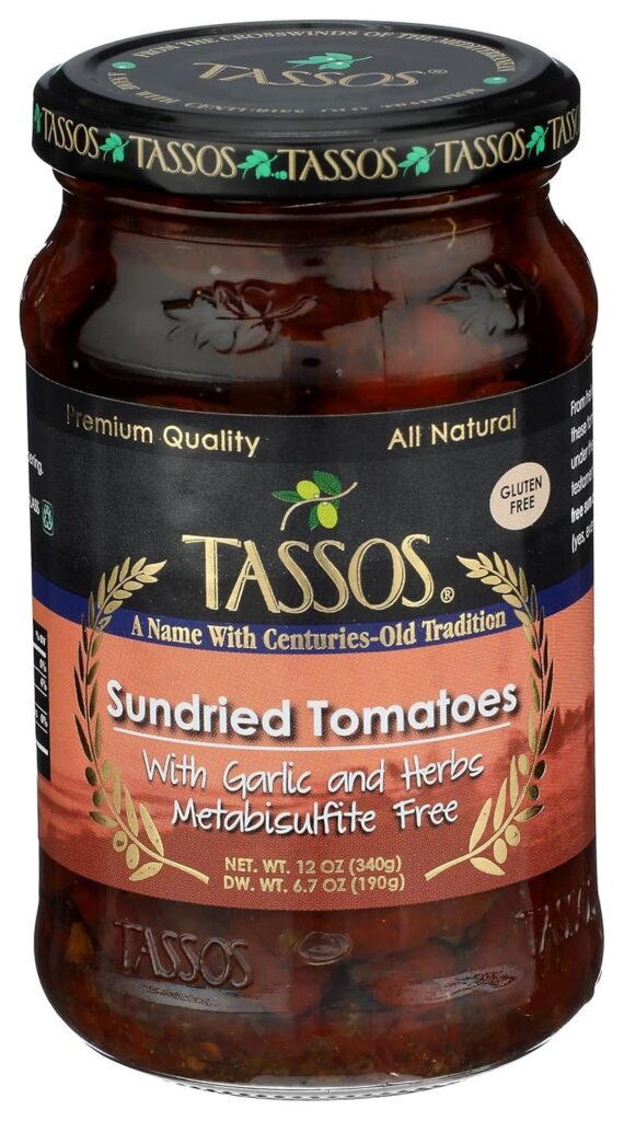 Jar of Tassos sundried tomatoes with garlic and herbs